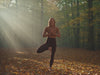 YIAN autumn yoga wear brand film — athletic woman in espresso and caramel high-waisted yoga set performing yoga poses against minimalist white curved architecture, golden hour urban setting, premium athletic brand aesthetic.
